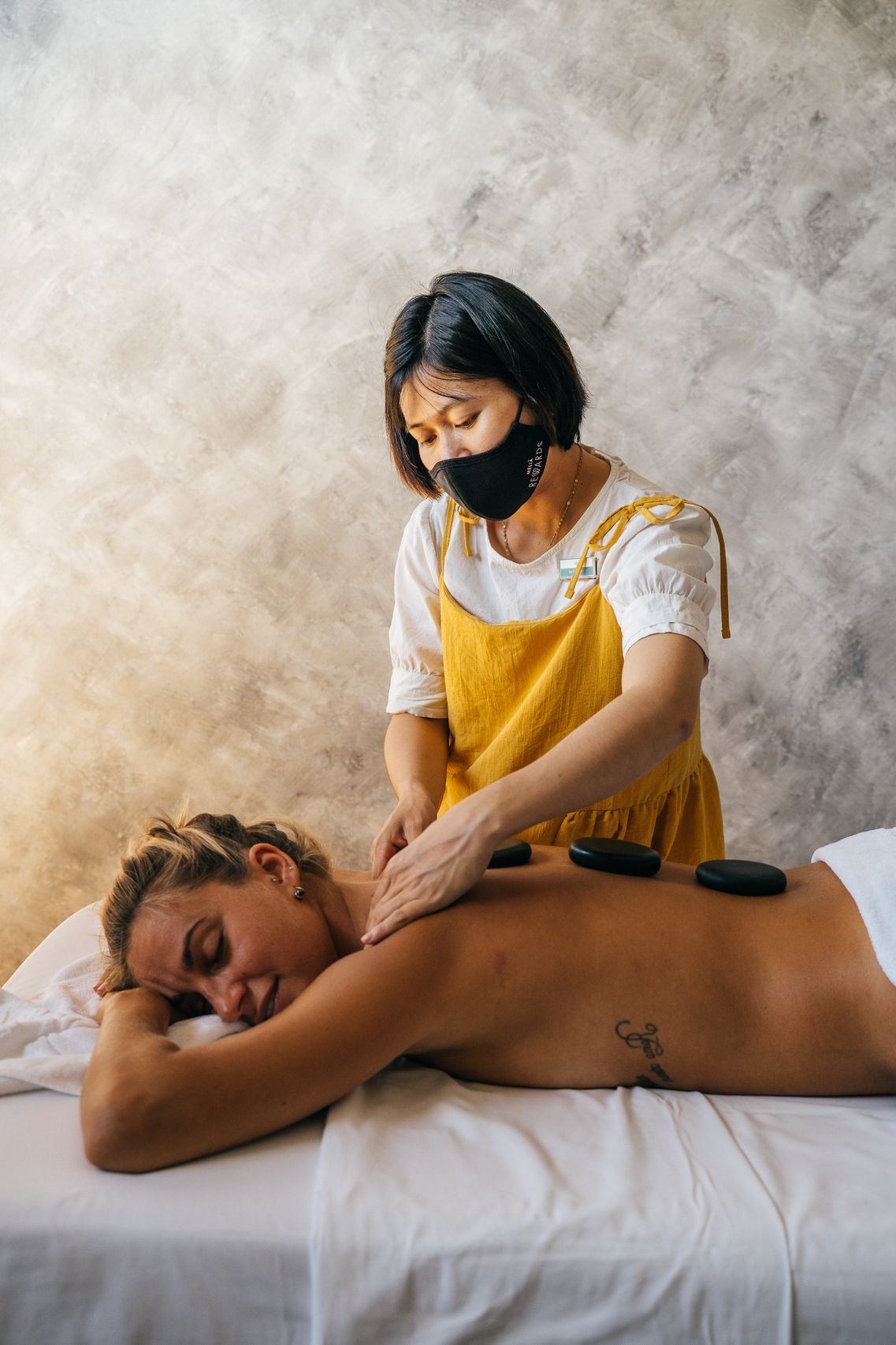 Spa treatment room with stone wall