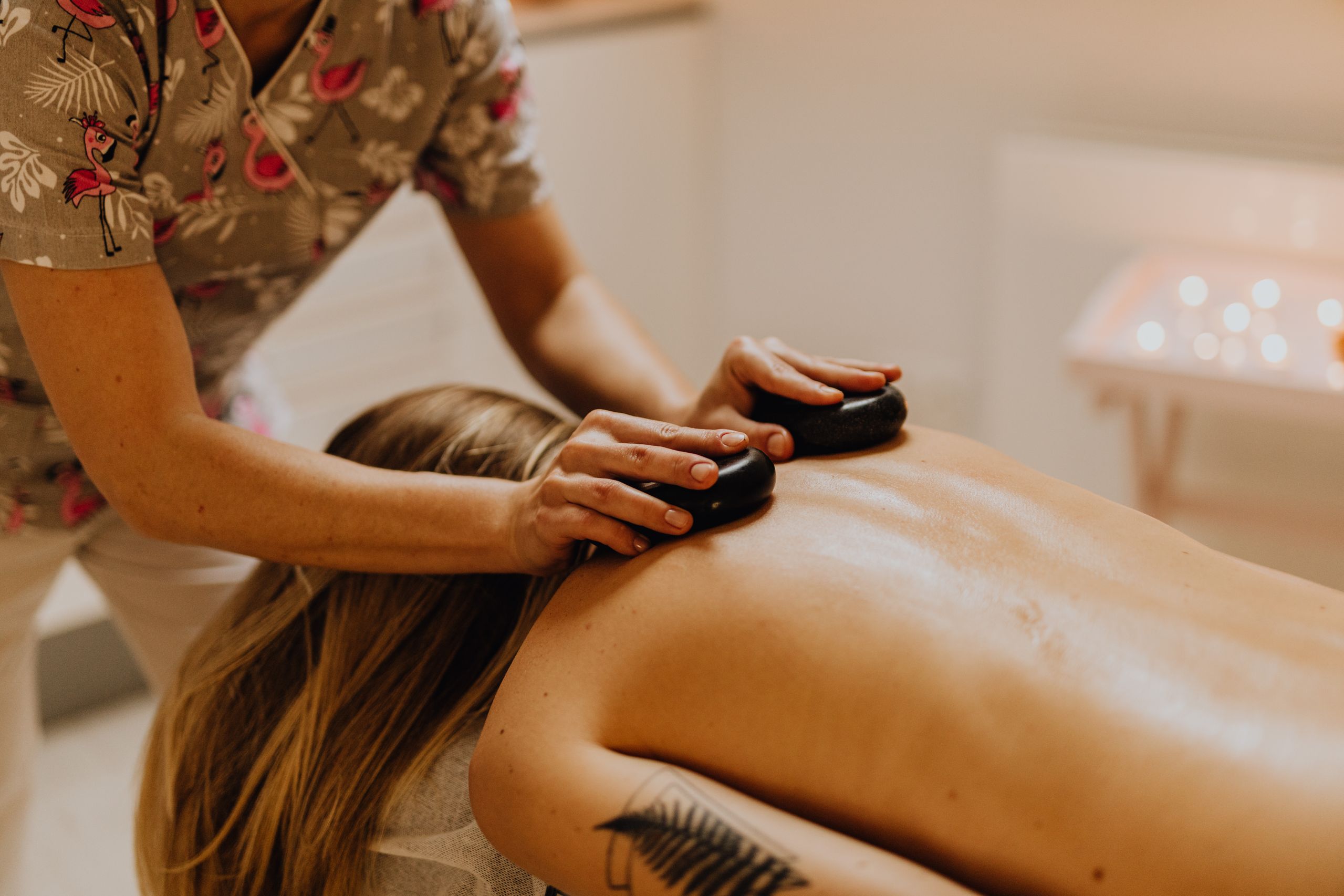 Woman receiving hot stone massage